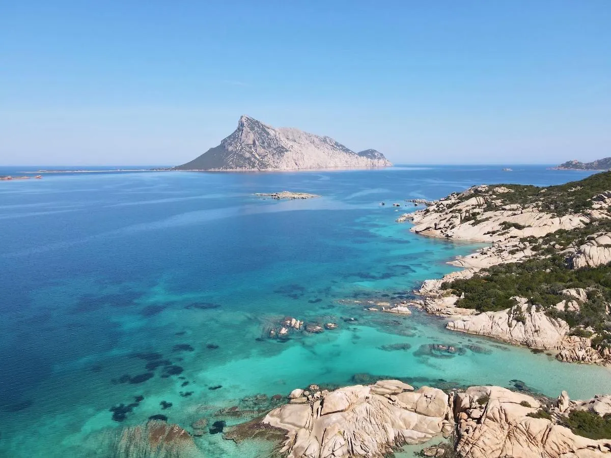 Iss Travel, Cottages Le Canne - Private Outdoor Area With Table And Chairs San Teodoro  Appartement San Teodoro (Sardinia)